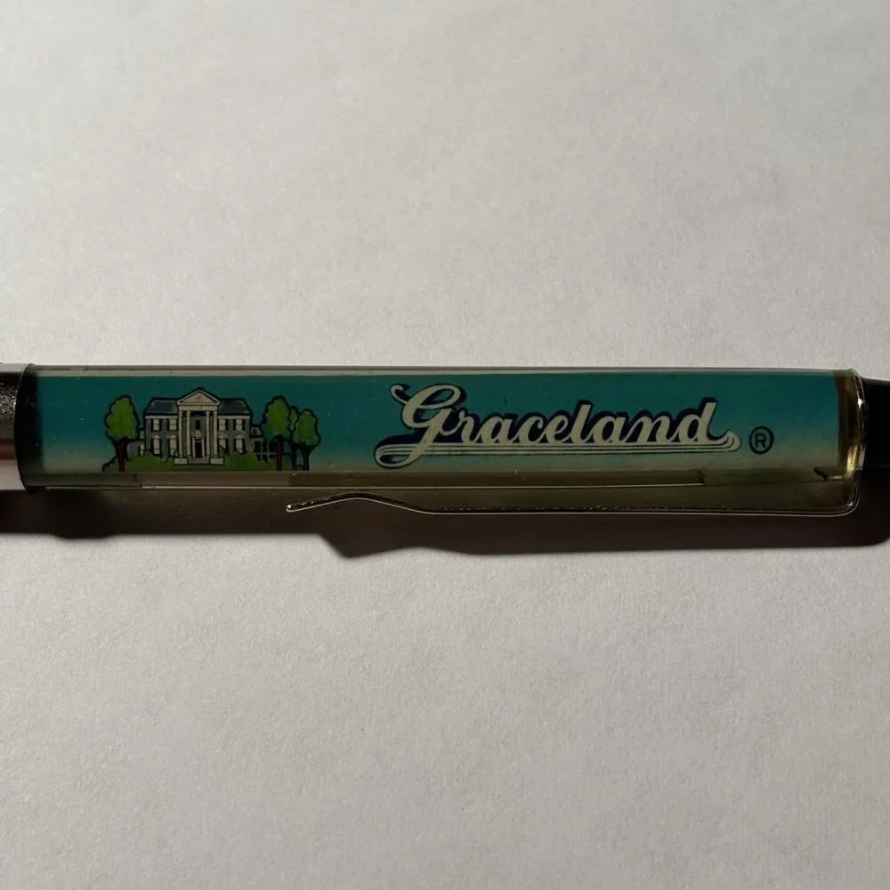 Graceland Floaty Pen Home of Elvis Presley Pink Cadillac Moves Souvenir Novelty